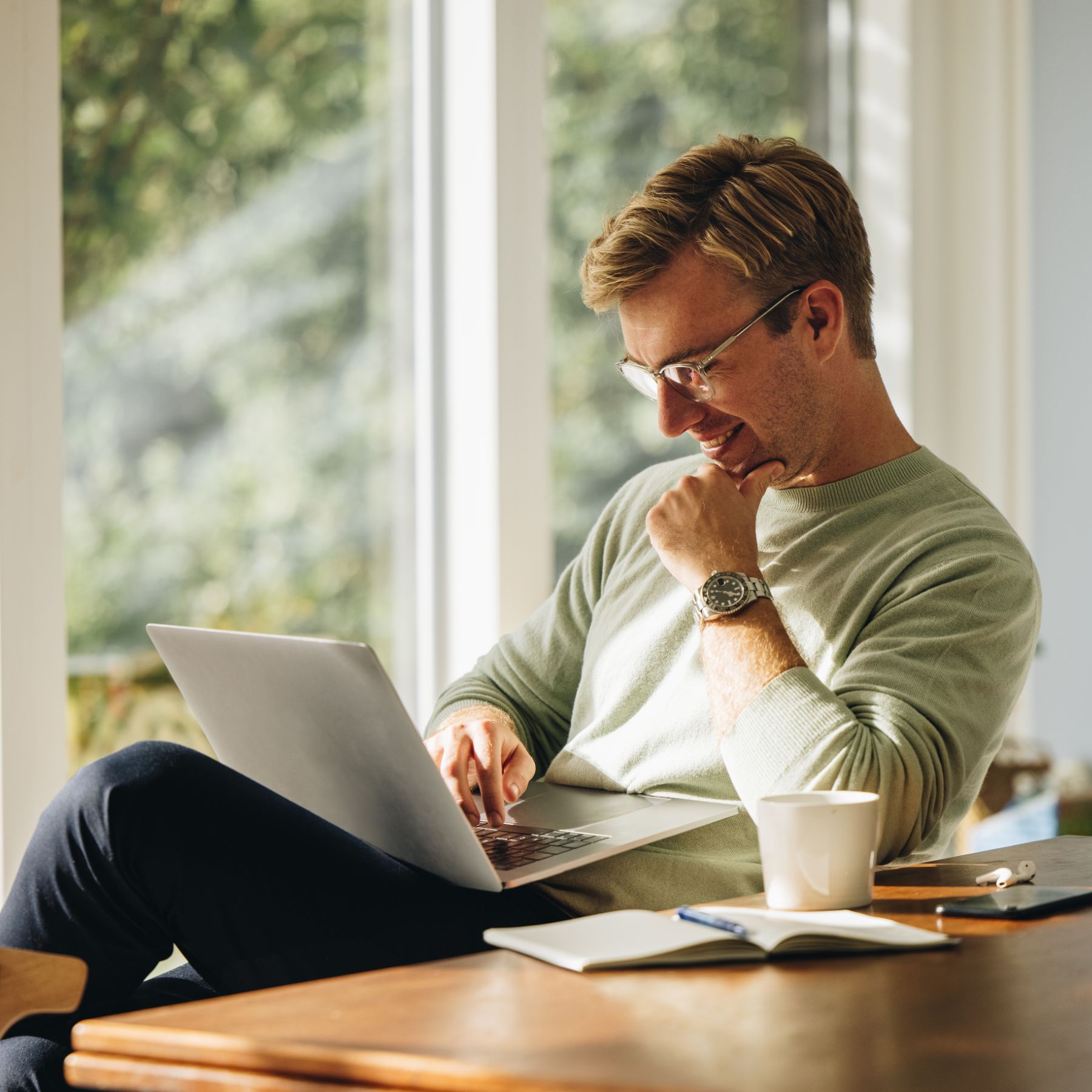 Smiling man working remotely